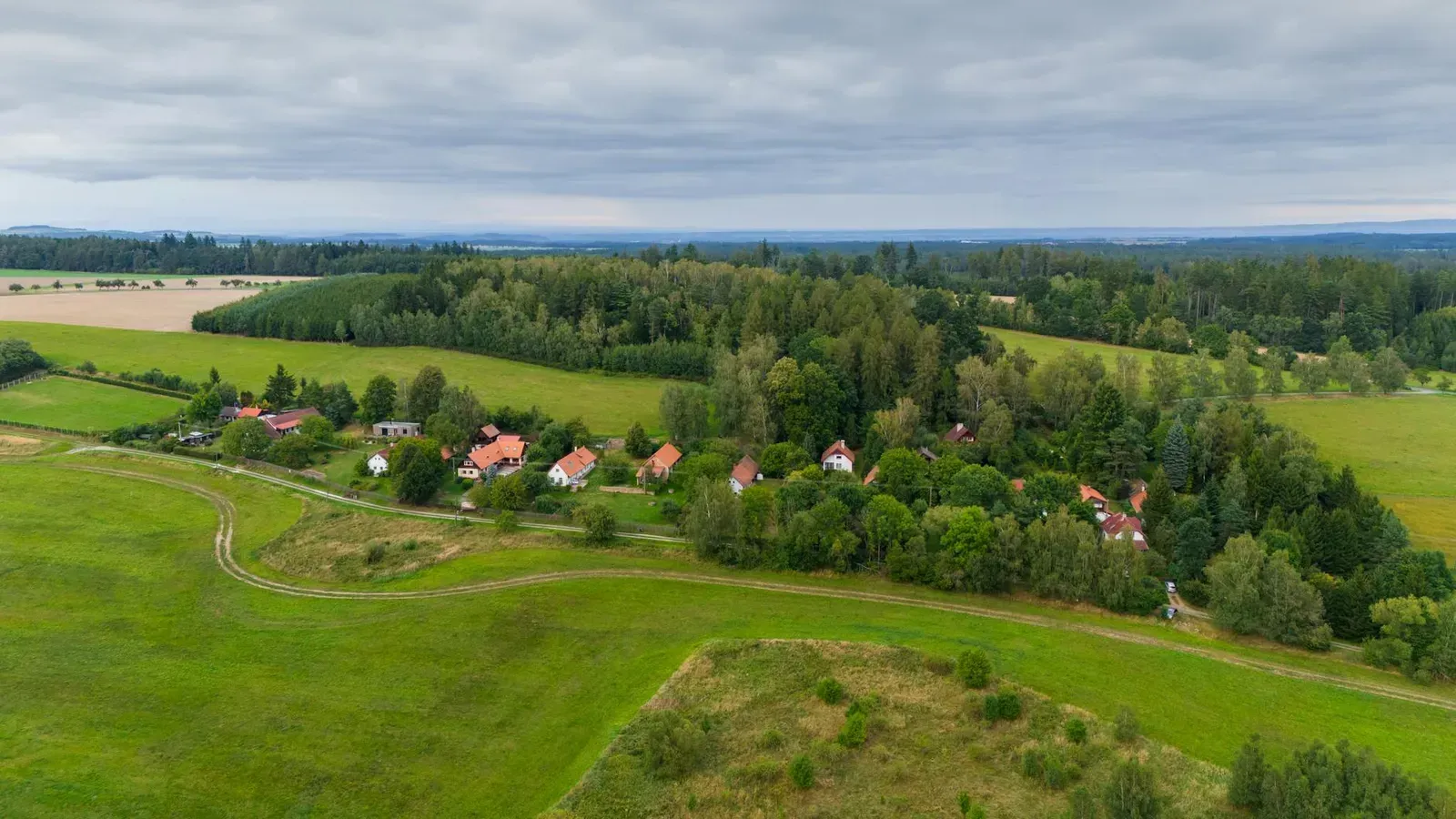 A tranquil aerial view of the rural landscape in Zbraslavice, Czech Republic, during summer.