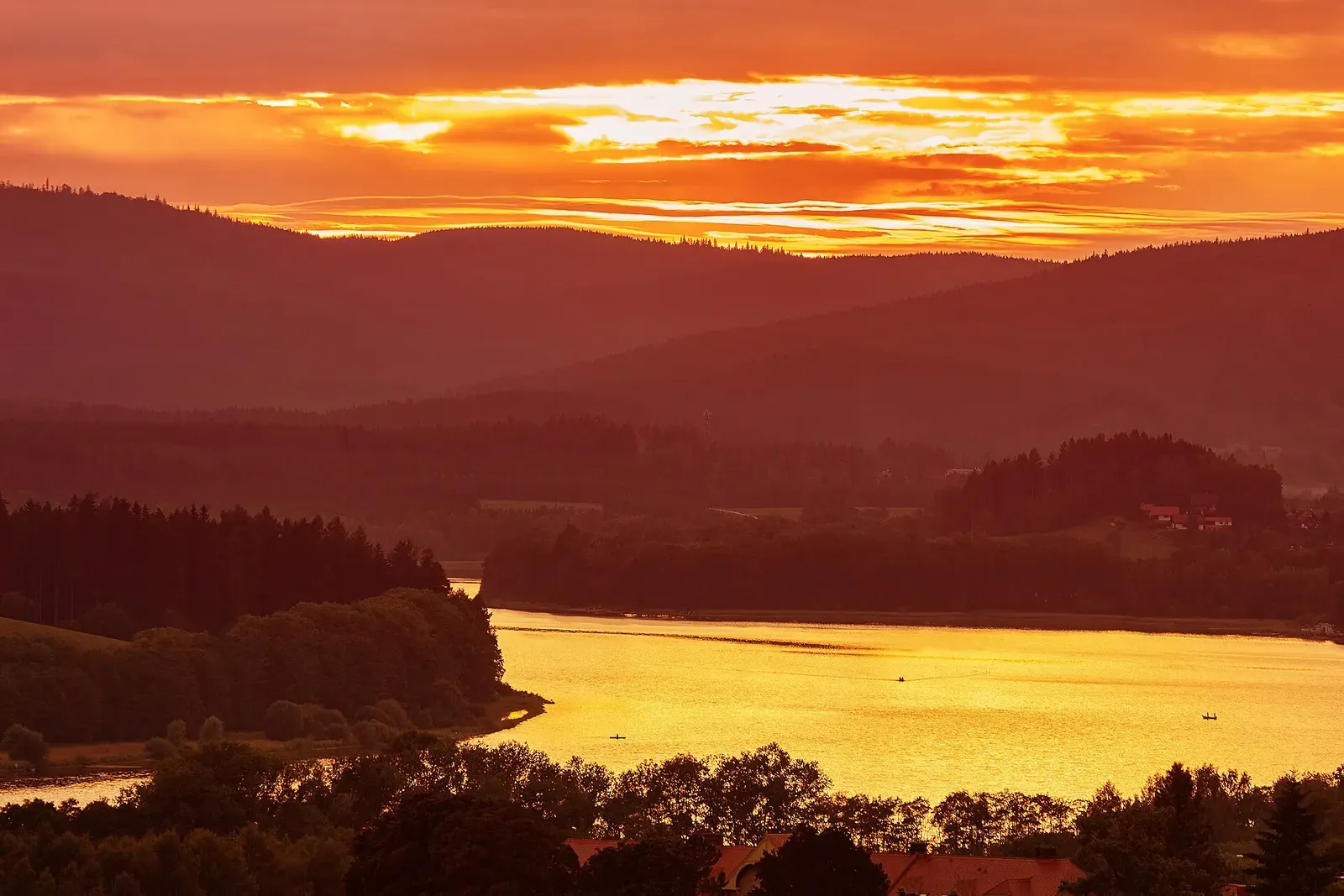 Colorful idyllic sunset landscape at lake Lipno, Czech mountains Sumava, Bohemian forest or Böhmerwald, Bavarian Forest or Böhmische Wald Colorful idyllic sunset landscape at lake Lipno