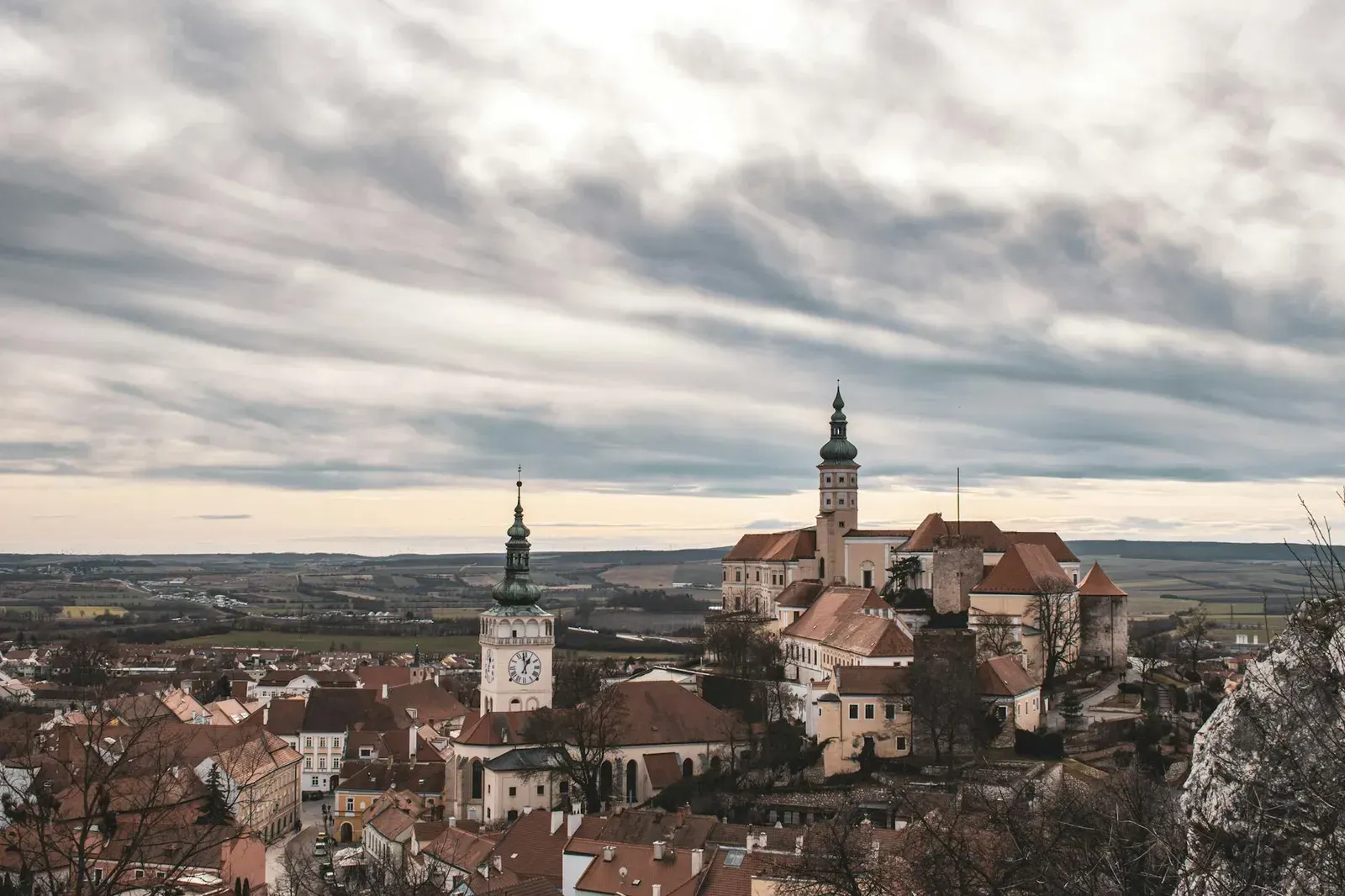 A picturesque aerial view of Mikulov's historic architecture and scenic landscape in the Czech Republic.