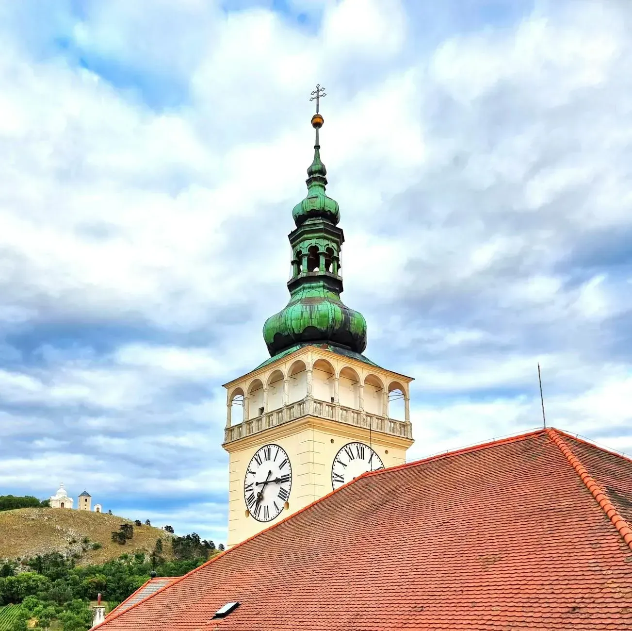 View of Mikulov Castle clock tower with scenic background in Czechia.