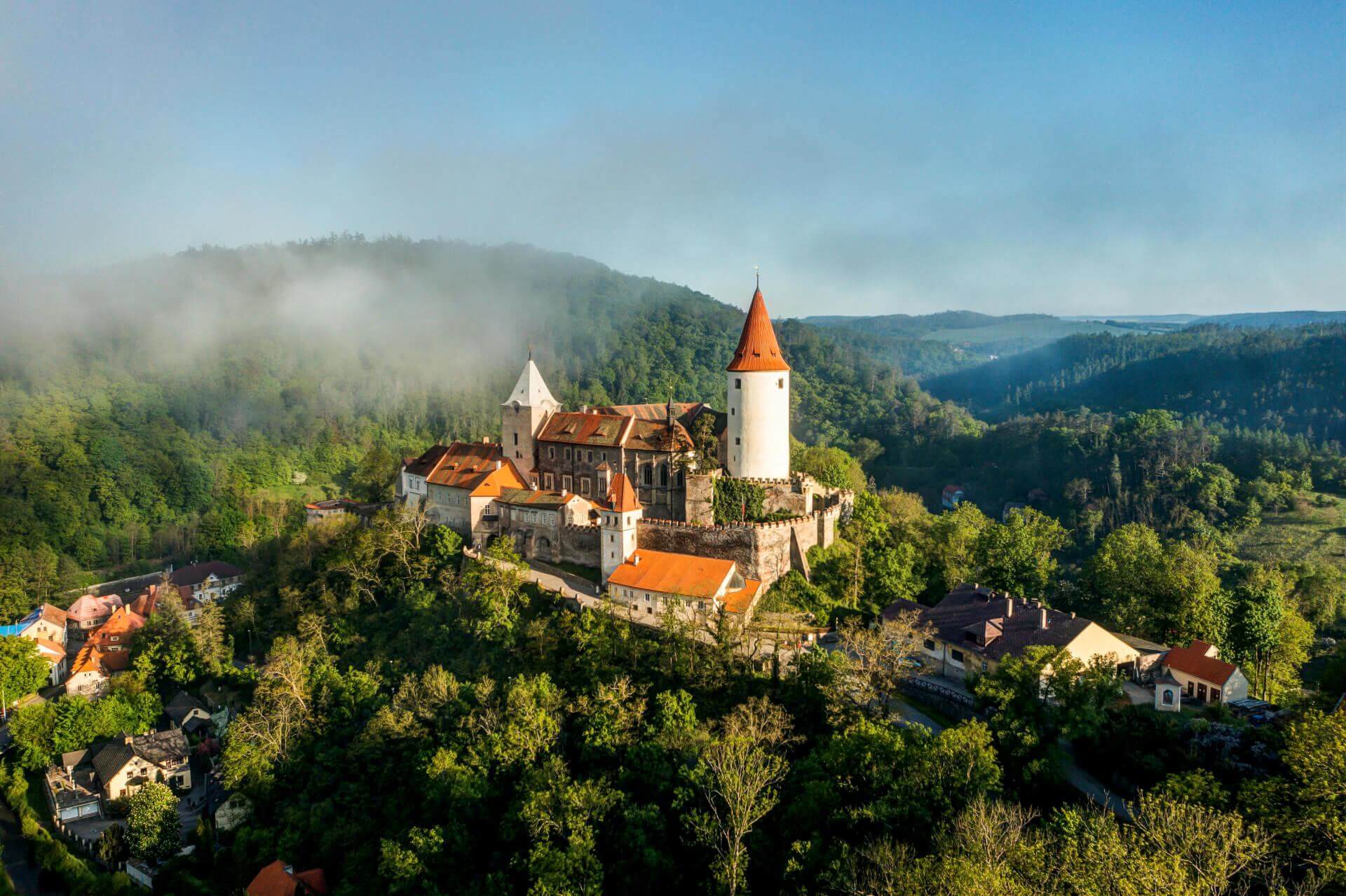 The imposing Křivoklát Castle, the 'Stone Heart of Bohemia', viewed from a distance.